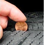 Checking tire tread for wear with a Lincoln penny